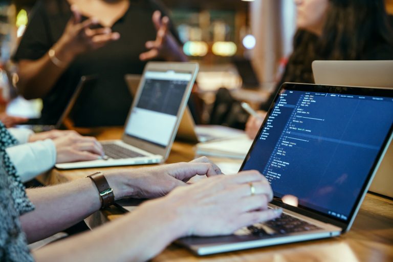Developer coding on laptop