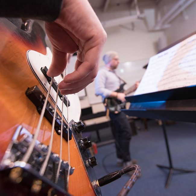 UMA Music Student Playing Bass