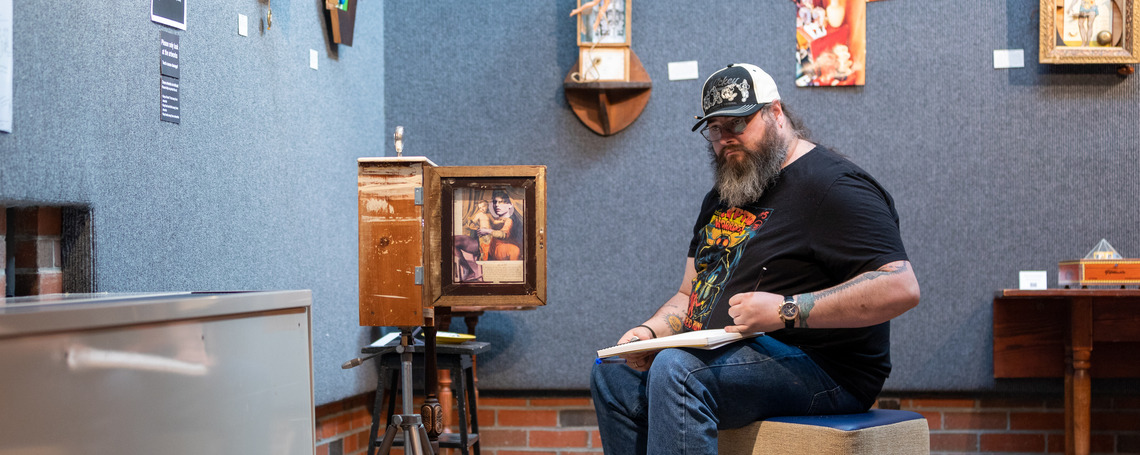 UMA Art student in the Danforth Gallery