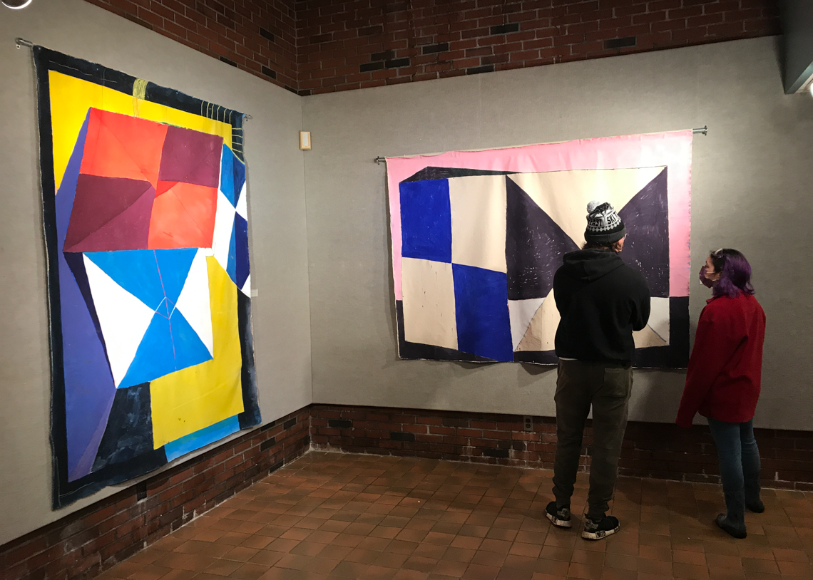 visitors with two artworks in the exhibition galen cheney the ecstatic tear