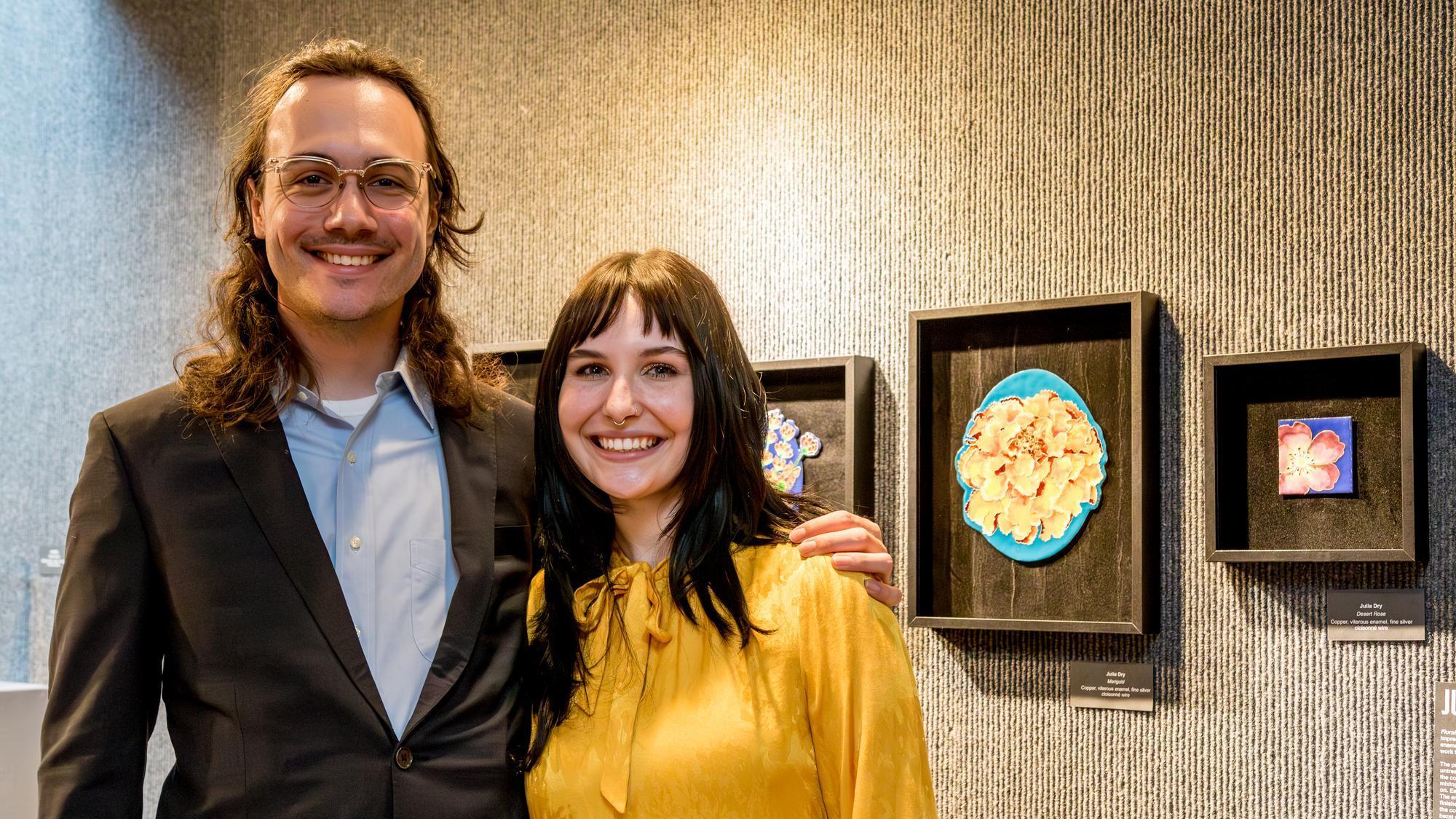 UMA Grads in art gallery