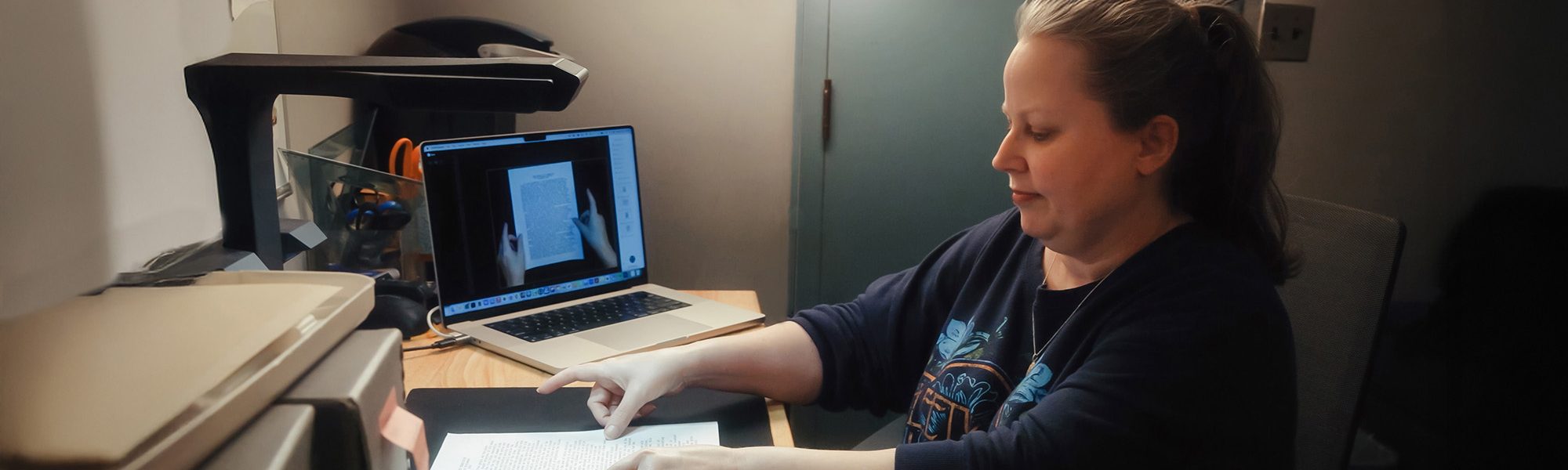 UMA ILS students working on an archival project