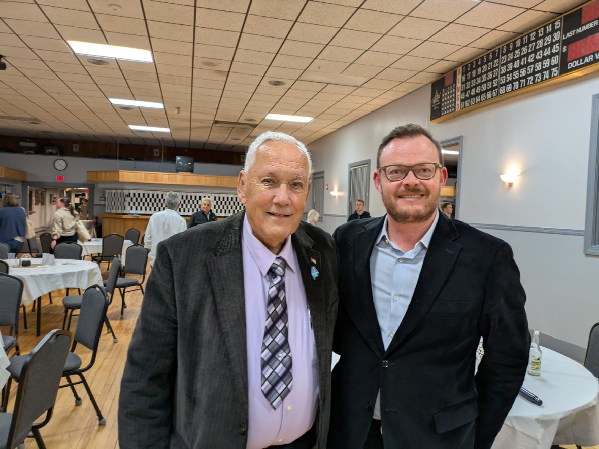 Two attendees pose together