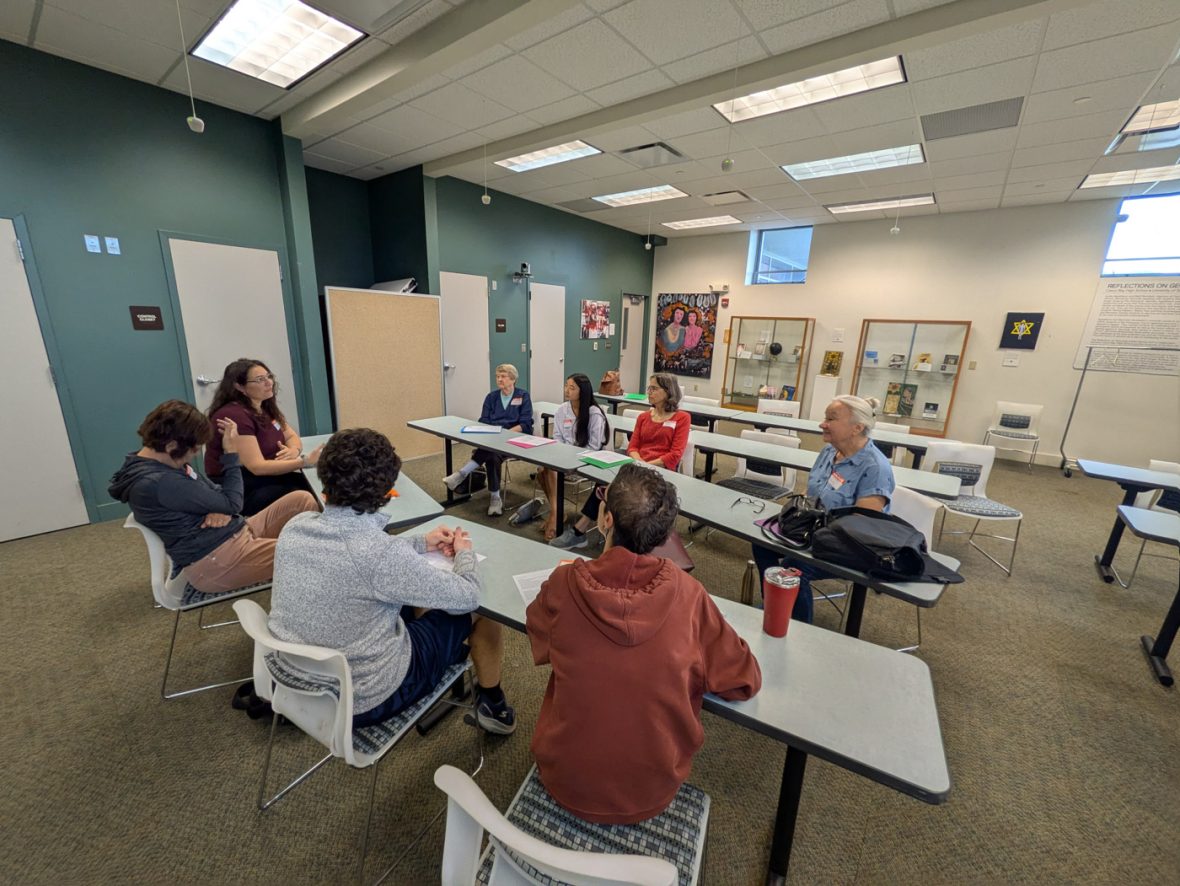 Instructor presents introductory French questions to participants in a classroom.
