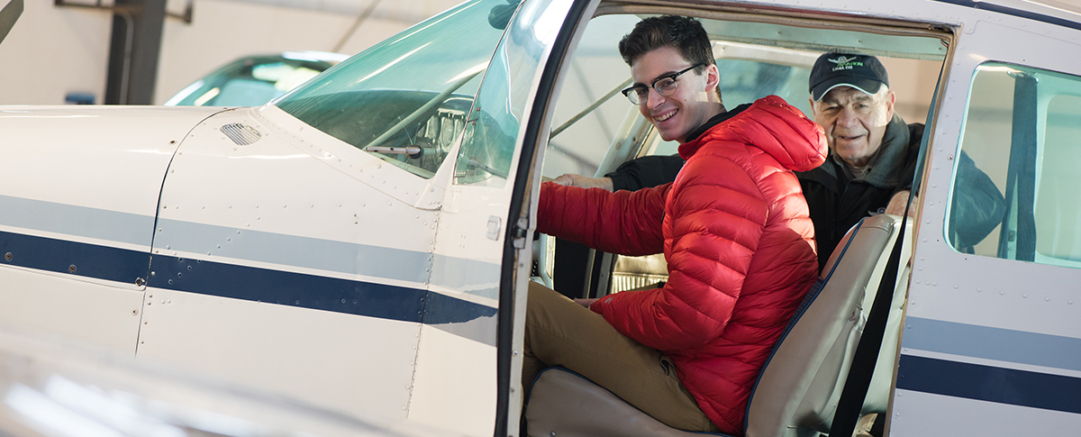student and teacher in airplane