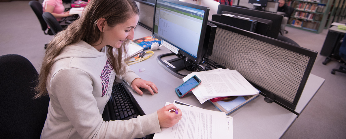 student doing homework at computer