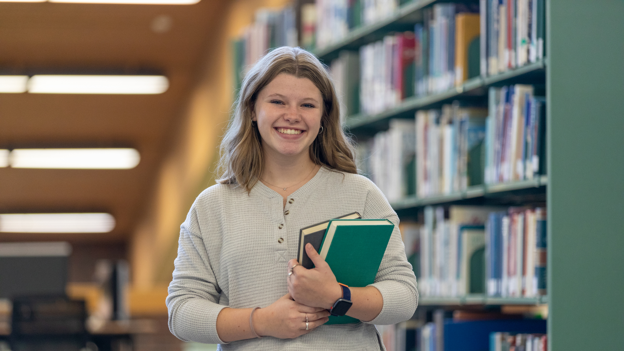 UMA Student in the Library