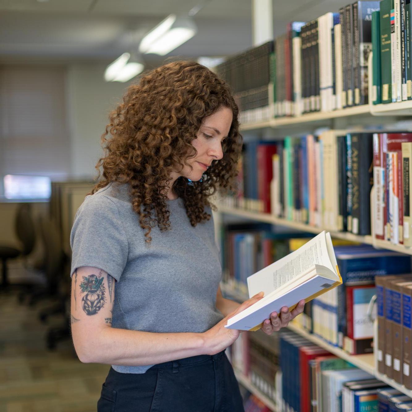 UMA student in the library