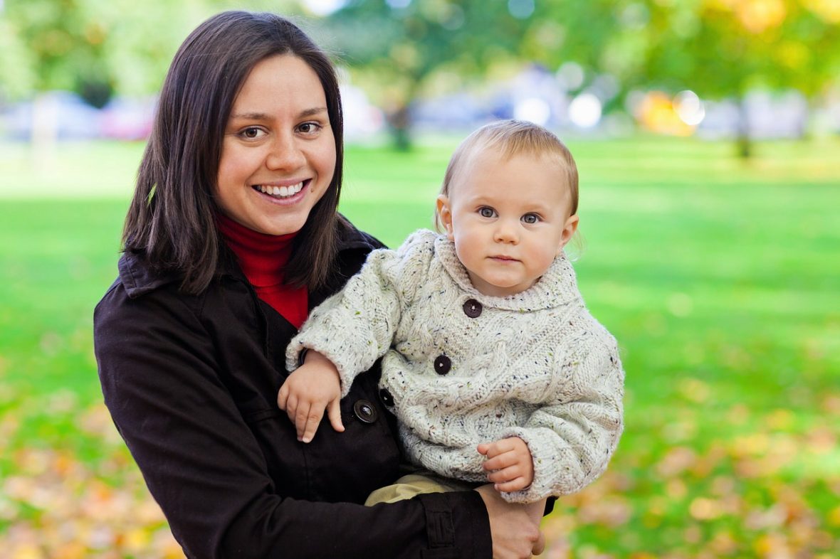 Female student holding baby