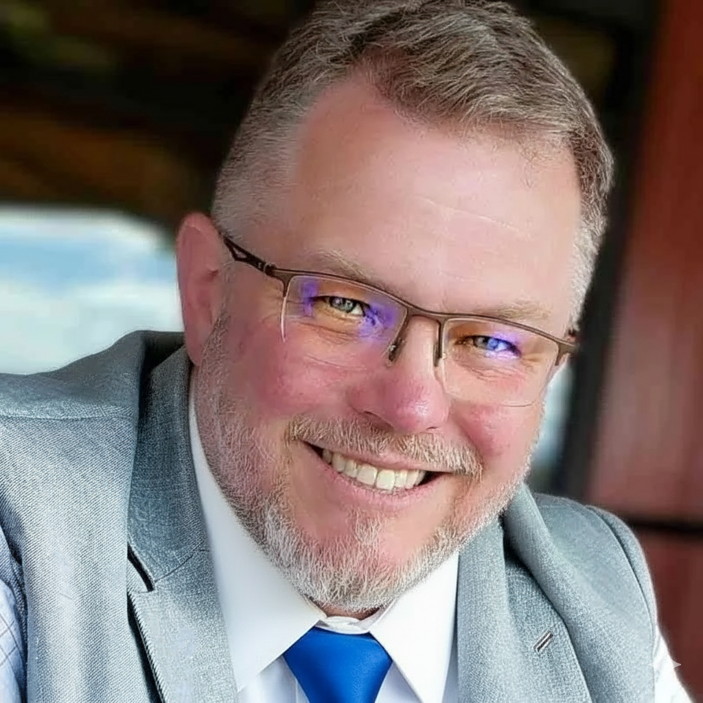 bj grey blazer wh shirt and blue tie gem