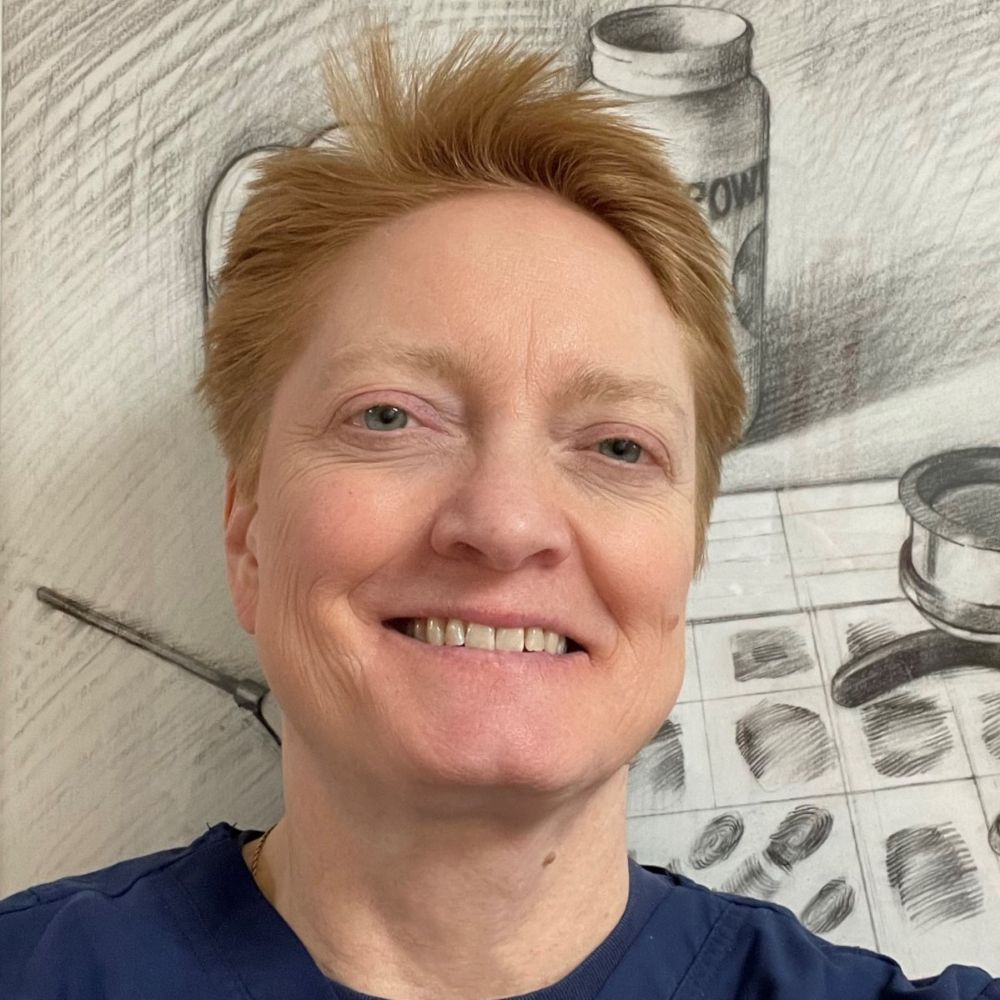 Cynthia Homer, a woman with short hair smiles in front of a pencil sketch background of a fingerprint record.
