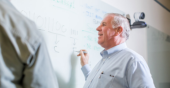 Professor at Whiteboard