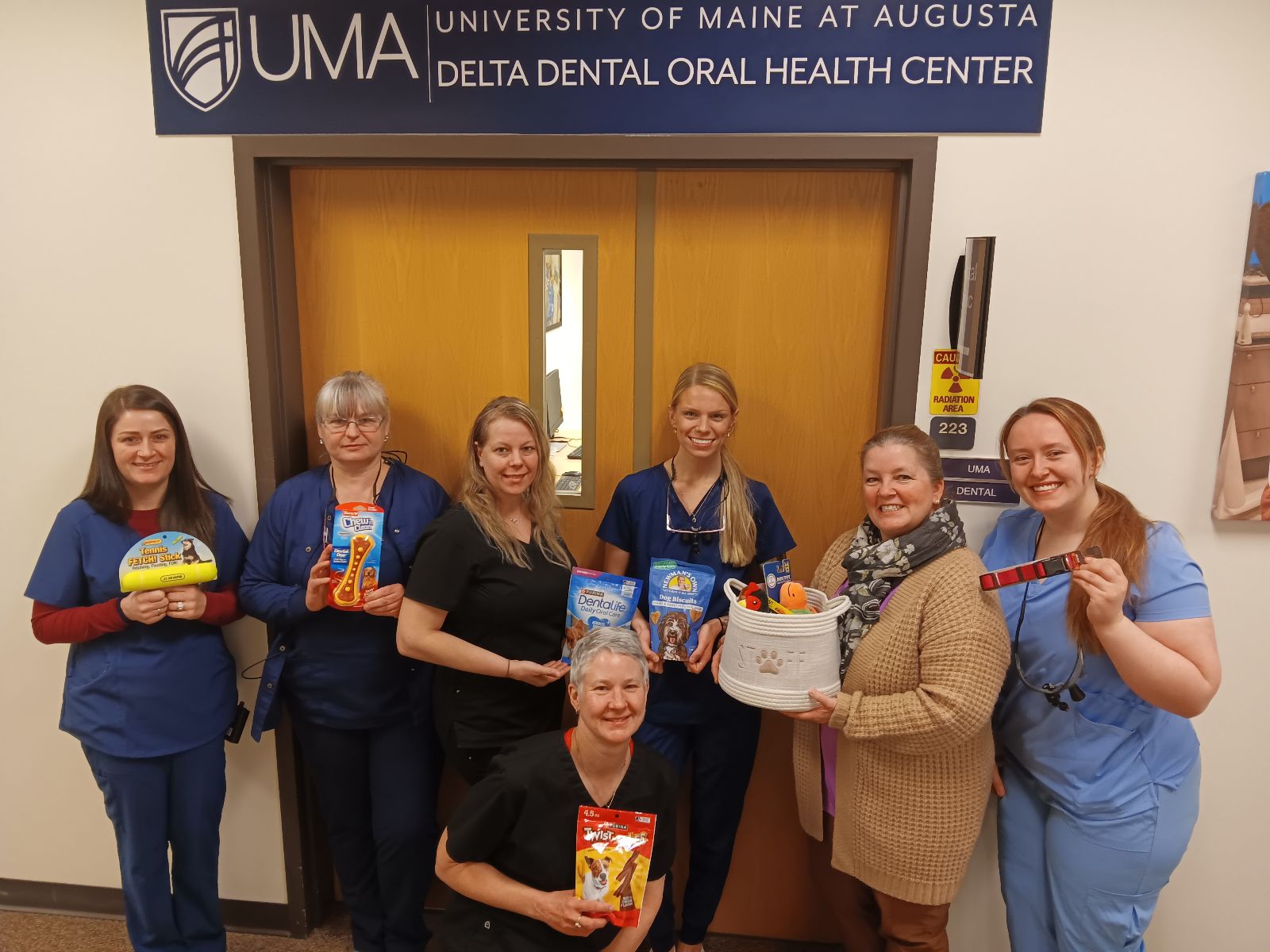 picture of dental students donating for pet food drive