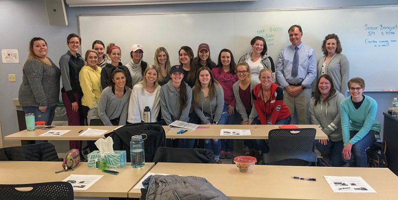 Dr. Leonard Brennan, DMD with UMA Dental Health students.