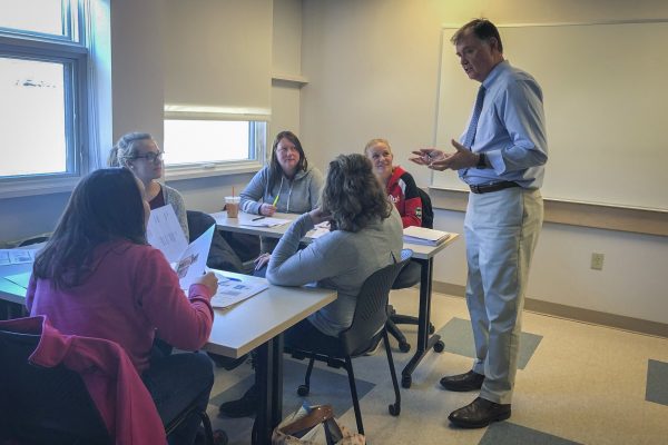 Dr. Leonard Brennan, DMD with UMA Dental Health students.