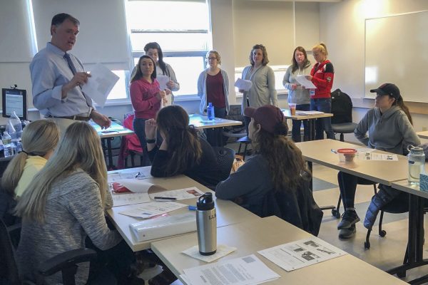 Dr. Leonard Brennan, DMD with UMA Dental Health students.