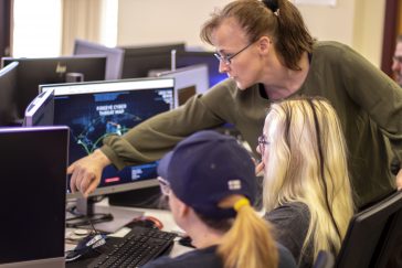 UMA Cybersecurity students working at a computer