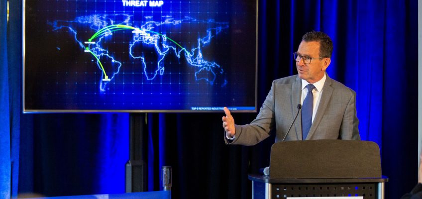 UMS Chancellor Dannel Malloy presenting during the UMA Maine Cyber Range ribbon cutting ceremony.