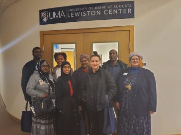 L/A College Transitions students visit UMA's Lewiston Center, pictured here with UMA's Lynn Poor (far right).