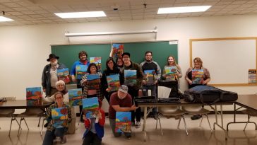 Photo of UMA Lewiston students showing off their completed works of art!