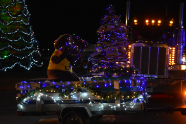 UMA's mascot Augustus the Moose rides a holiday float in the Rockland Festival of Lights Parade.