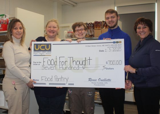 USU presents check to SGA on Bangor Campus