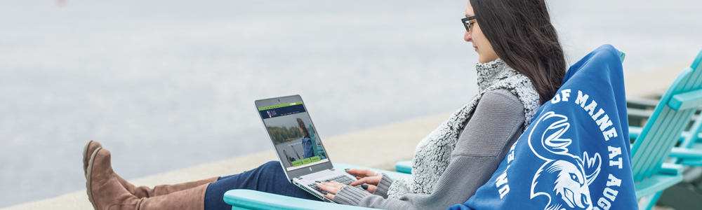 UMA-Woman-Student-on-Laptop-on-the-Riverside
