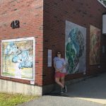 Murals on outdoor brick wall