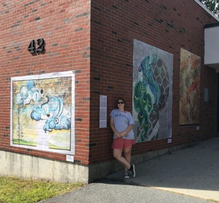 Murals on outdoor brick wall