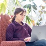 UMA student on laptop