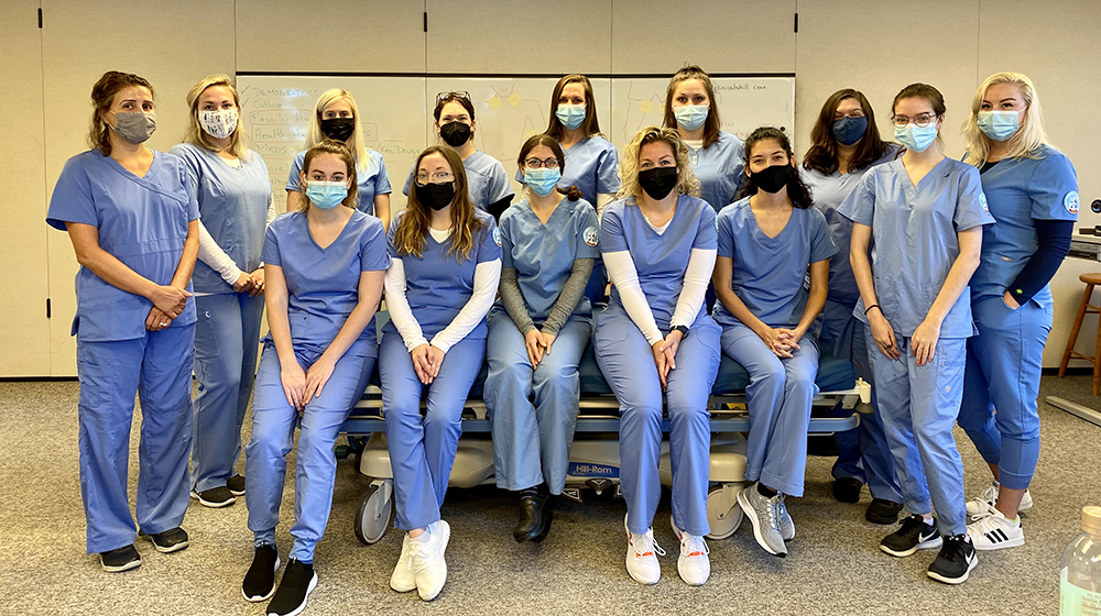 Nursing students in scrubs and face masks at UMA Rockland