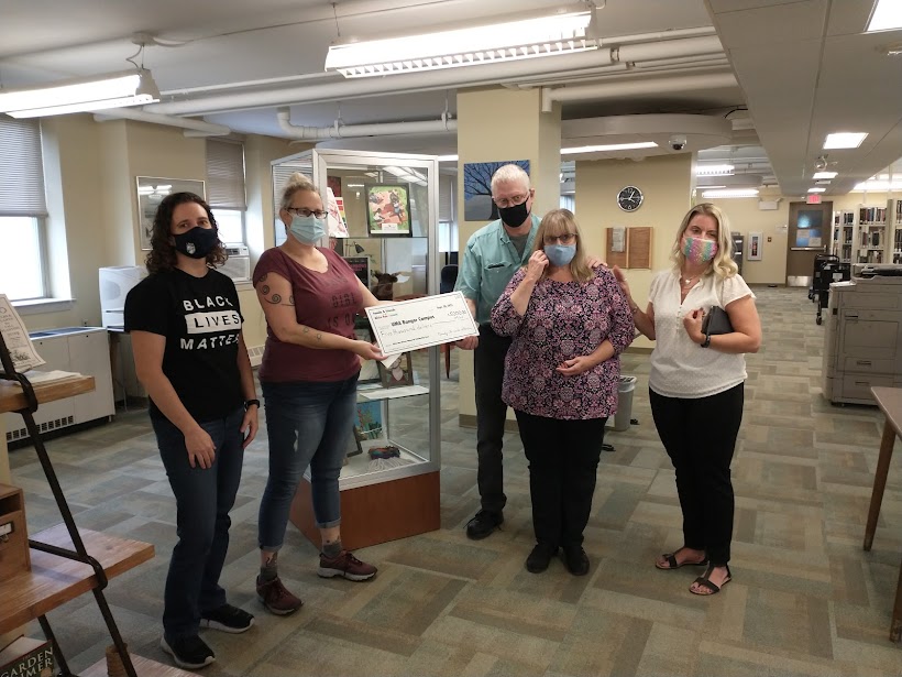 Bessey's family making a donation to UMA scholarship fund