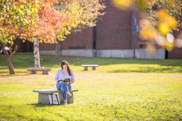UMA Student Studying on Campus