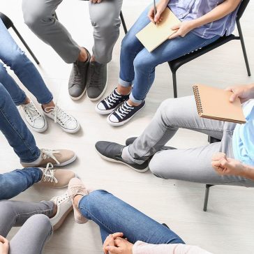 substance abuse rehabilitation technician working with clients in group therapy