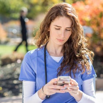 UMA student using a smartphone