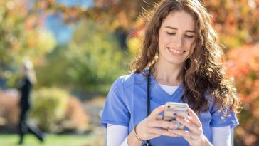 UMA nursing student using a smartphone