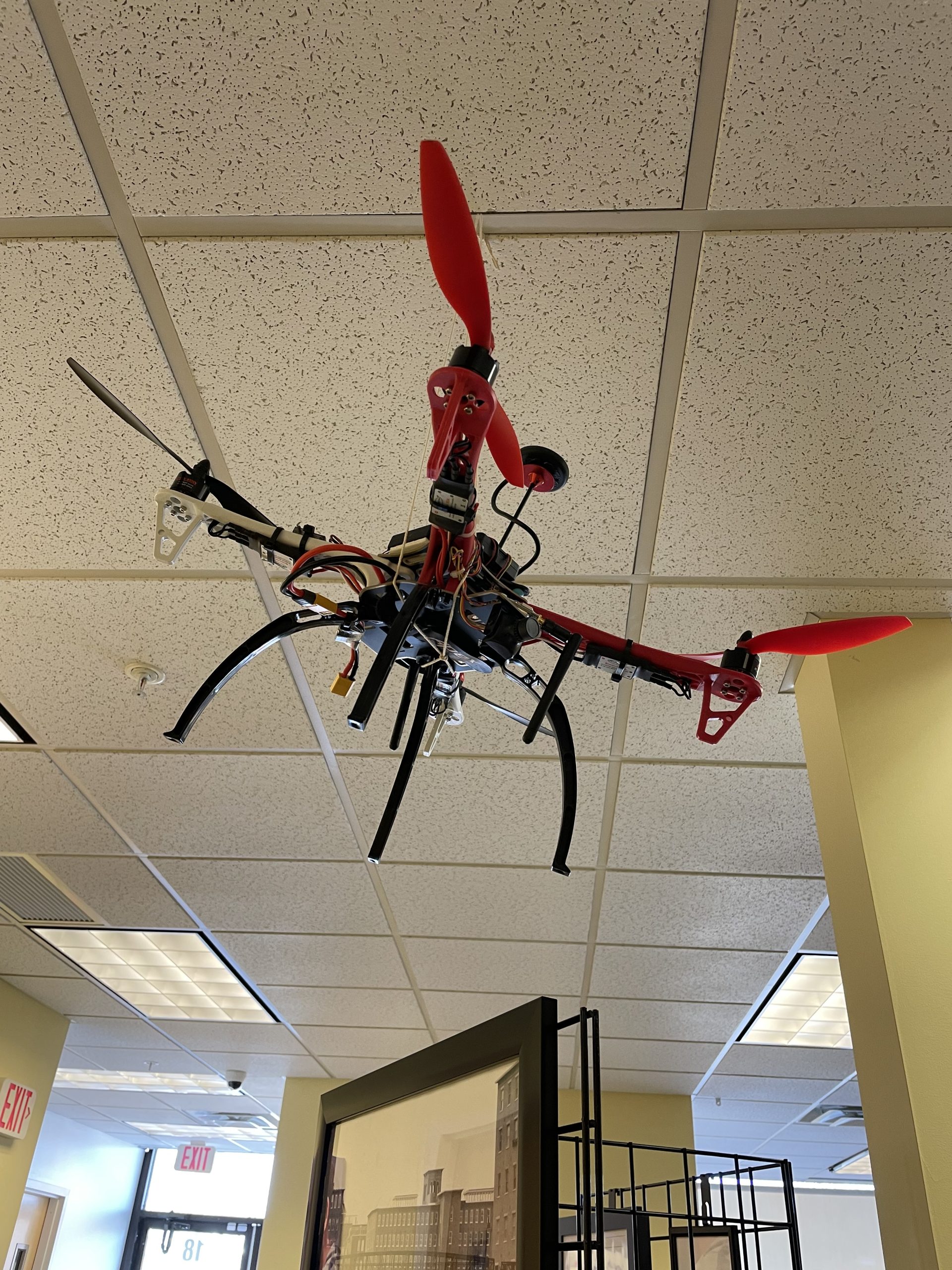  A close up of the underside of the hanging drone on display.