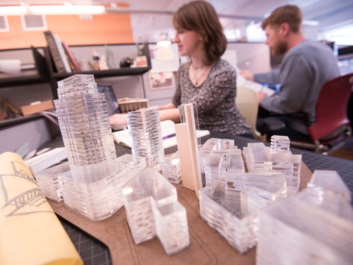 Architecture students with 3-D building models