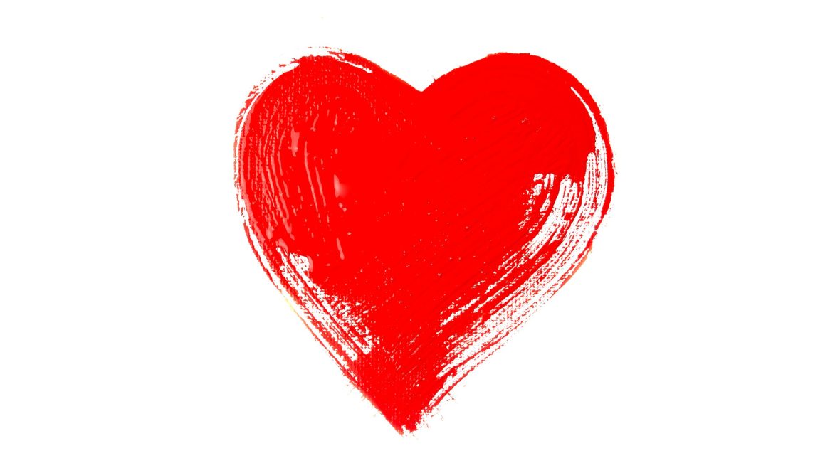 red heart on a white isolated background painted with paints and a brush. the concept of valentine's day.