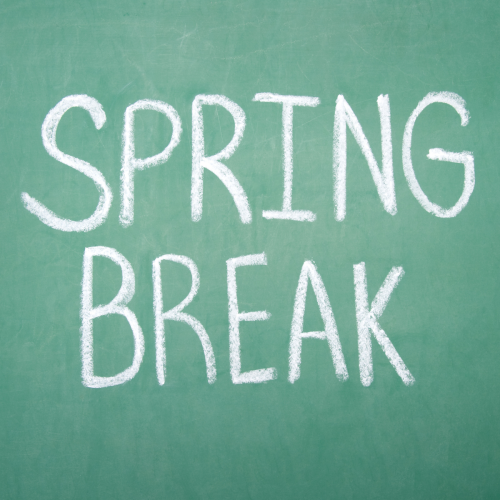 White chalk lettering "SPRING BREAK" written on a green chalkboard.