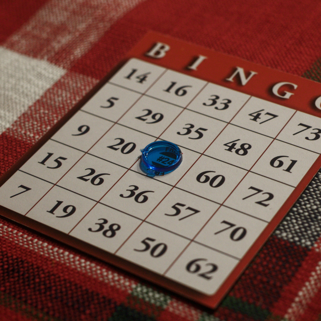 A picture of a Bingo board with a blue piece in the middle.