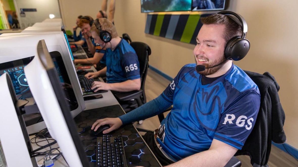 gamers playing in the esports arena