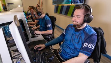 gamers playing in the esports arena