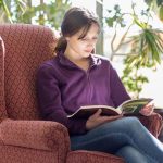 UMA student reading in the Katz Library