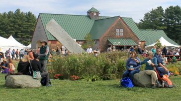 People talking at the Common Ground Fair