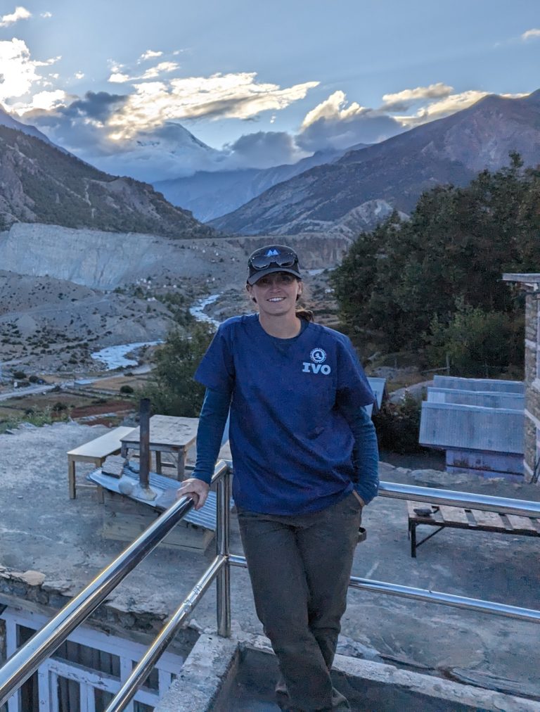 Dr. Kelby Myers with Nepal mountains in the distance
