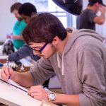 UMA Architecture Student working dilligently on sketches