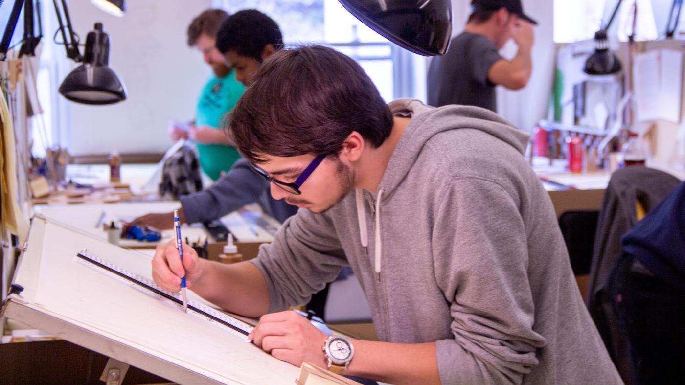 UMA Architecture Student working dilligently on sketches