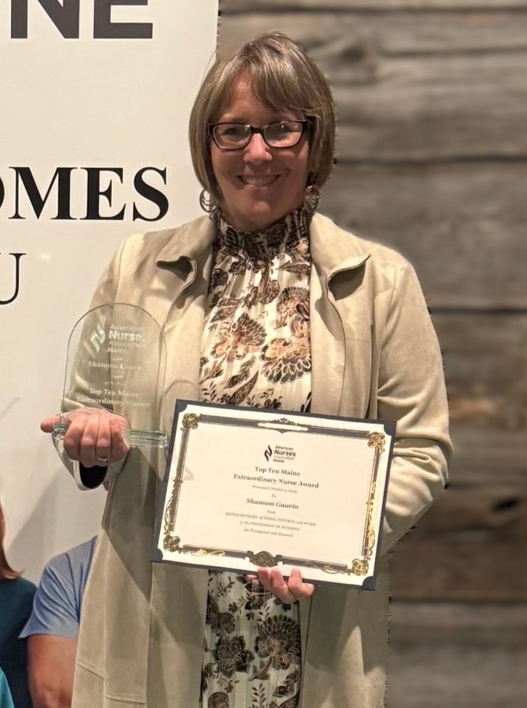 Shannon Gauvin with ana award and certificate