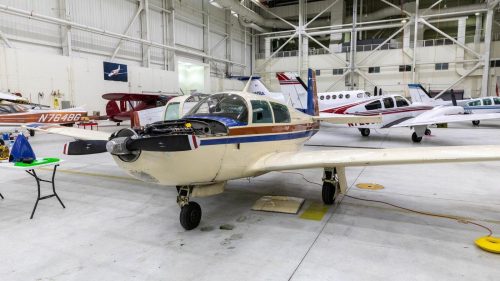 UMA AMTS program airplane with hood open in Hangar 6